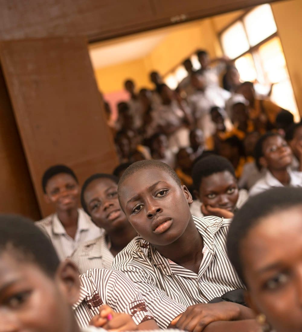 Young Tanzanians working together in a classroom session