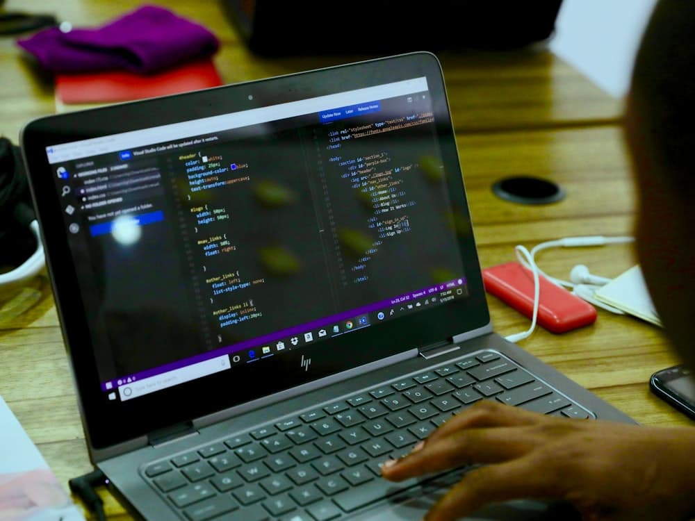 A young person working on a laptop during a training session